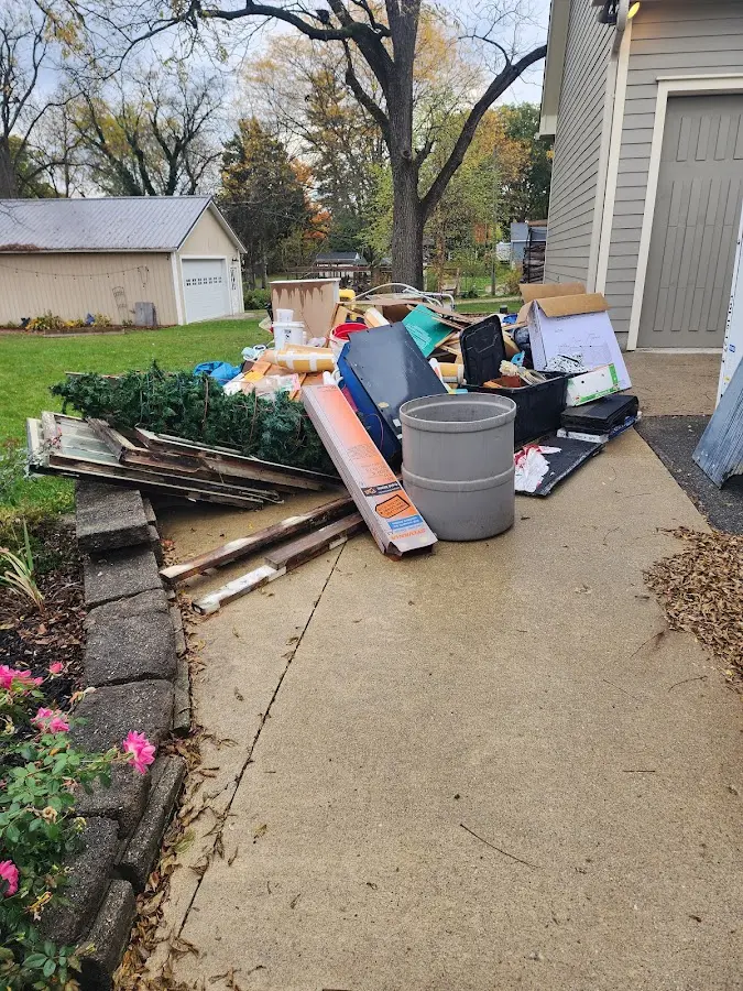 Dumpster being loaded with debris for Commercial Dumpster Rental in Southside